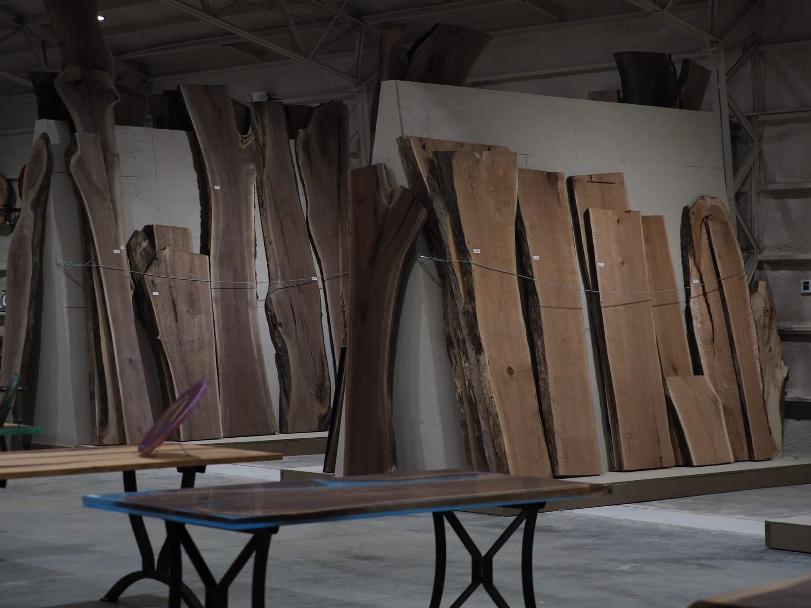 Freshly milled live-edge slabs in the APOC workshop